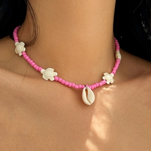 Pink beaded summer beach necklace with white turtle charms and natural shell pendant