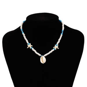Detail of beach-style necklace with white beads, sky blue accents and starfish shell charms
