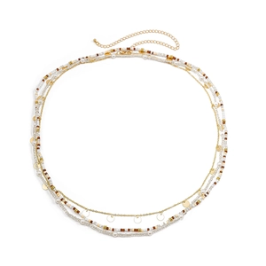 Detail of bohemian layered waist chain with gold sequins, pearls, and colorful seed beads