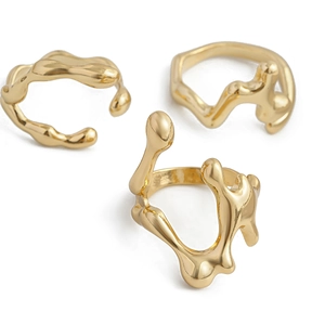 Three-piece gold irregular lava stackable ring set with minimalist liquid metal design