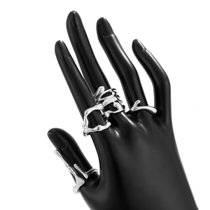 Irregular silver lava rings with molten fluid design shown on a black hand model