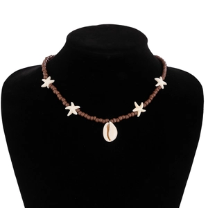 Detail of bohemian beach necklace with brown wood beads, cowrie shell, and white starfish