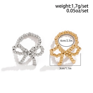 Detail showing measurement of beaded bow ring in gold and silver, 1.7g lightweight design