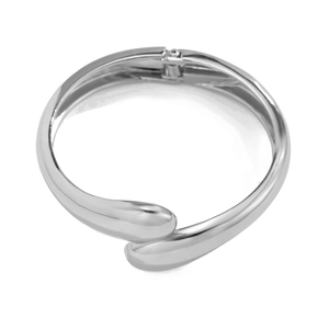 Detailed view of silver metal bracelet with a spring hinge and high-polish mirror finish