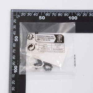 Quality check of bow beaded stretch rings in black and white styles with measurement scales