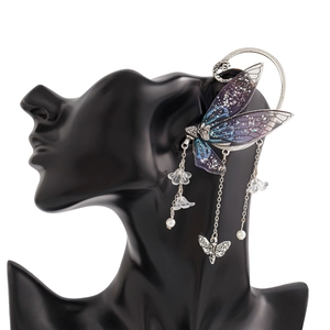 Detail of silver fairy ear cuff with blue butterfly wings, long tassels and pearl charms