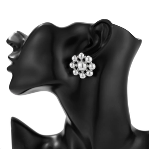 Polished silver floral bead earrings shown on a black matte mannequin head model