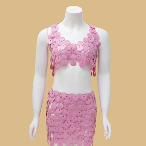 Detail view of pink sequin disc halter crop top and mini skirt party body chain
