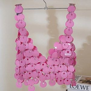 Detailed view of handmade pink round sequin crop top connected by small metal rings
