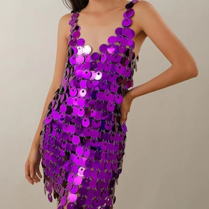 Detailed view of purple sequin chain dress featuring metallic discs and hollow-out design