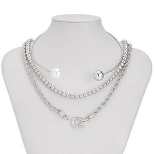 Detailed view of triple-layered silver necklace with pearls and chunky cable chain links