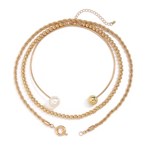 Three-layer gold necklace set featuring twist chain, ball chain, and pearl choker