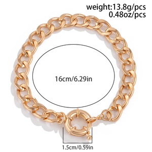 Detailed view of golden curb chain bracelet featuring large round spring clasp and dimensions