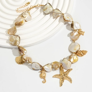 Detail of seashell necklace with gold starfish and seahorse charms on a white stand
