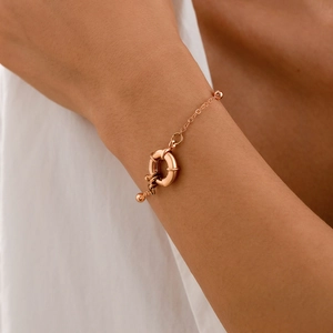 Rose gold geometric bracelet featuring a lifesaver spring clasp on a delicate bead chain