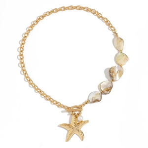 Detail of gold starfish pendant and white shell pieces on a nautical choker necklace