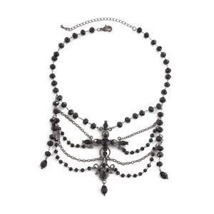 Close-up of black beaded gothic choker with layered chains and drop pendants on white background