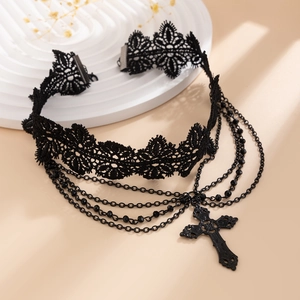 Detailed close-up of gothic lace choker with layered chains and black cross pendant