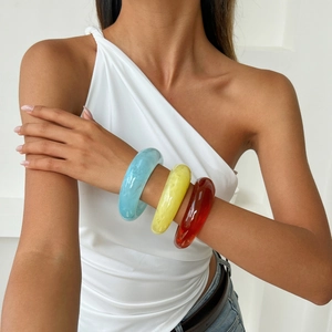 Fashionable colorful acrylic resin bangles with marble textures for a retro modern look