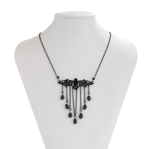 Close-up of gothic black bat pendant necklace with tassel water drop beads on a neck model