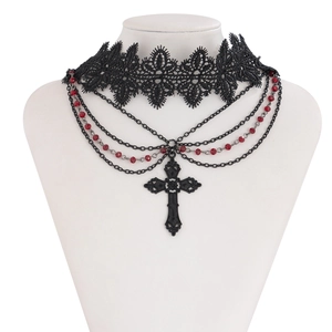 Detail of gothic lace choker with layered black chains, red beads and cross pendant