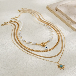 Vierteiliges Goldketten-Set mit Sonnenanhänger und Evil Eye Perlenkette im Lagenlook