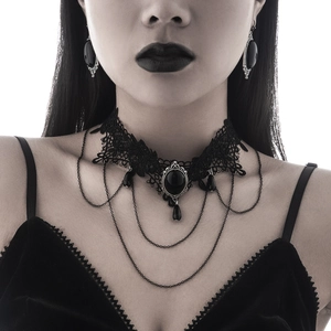 Close-up of Gothic black lace choker necklace with dark gemstone and fringe detail