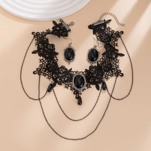 Detail of Gothic black lace choker and earring set with vintage silver frames and drops