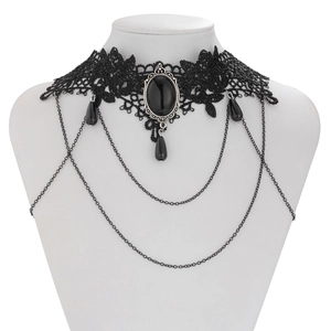 Close-up of Gothic black lace choker with center oval gemstone and draped metal chains