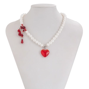 Detail of Gothic pearl choker with red heart pendant and blood-drop crystal charms