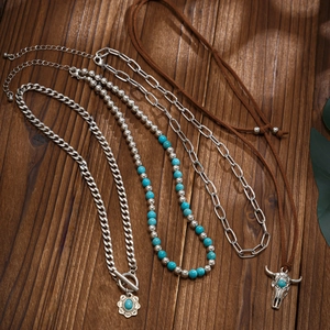 Layered bohemian necklace set with turquoise beads, bull head charm and vintage pendants
