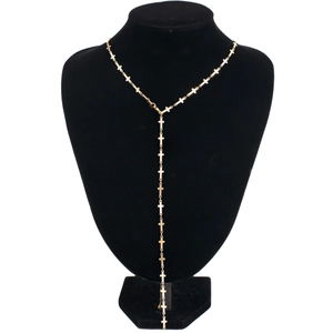Golden Y-shaped long necklace featuring elegant small cross charms on a black display