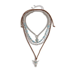 Layered bohemian necklace with turquoise beads and a vintage bull skull pendant