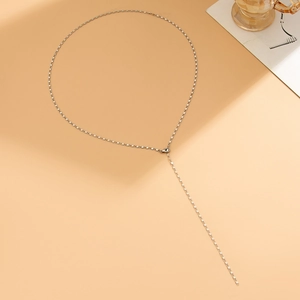 Detail of silver Y-shaped tassel necklace with rectangular chain links and lobster clasp