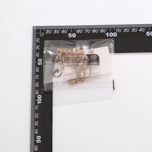Golden Y-shaped chain necklace shown next to a ruler for precise size measurement