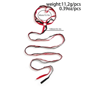 Detailed flat lay of red and black leg chain with elastic strap and 140cm long ribbon