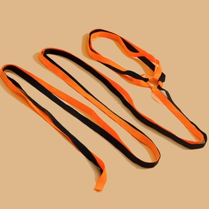 Close-up of bright orange and black elastic leg chain with a metal ring fastener