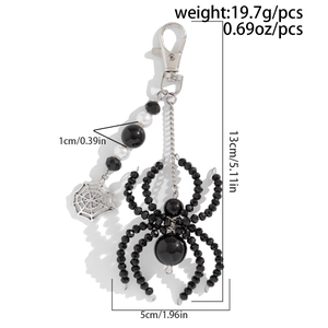 Detail of beaded spider keychain set with silver web pendant and measurement specs
