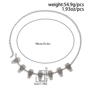 Silver gothic body chain with coffin charms featuring spiderweb and heart details