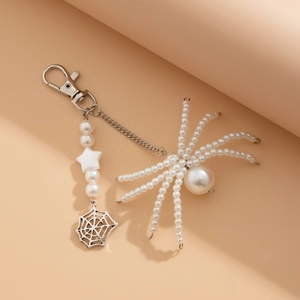 3-piece set featuring pearl spider keychain, woven charm and sun flower metal accessories