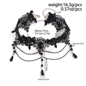 Detail of gothic black lace choker with dark gemstone teardrop beads and metal chains