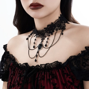 Detail of gothic black lace choker with cross crystal beads and tassel drop fringe