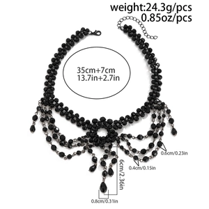 Detailed view of black beaded lace choker with layered fringe and crystal cross pendants