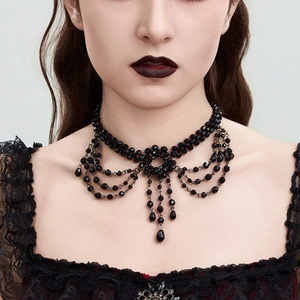 Detail of gothic black beaded choker with vintage crystal fringe and teardrop pendant