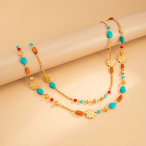 Bohemian long beaded necklace with turquoise stones and golden mandala flower pendants