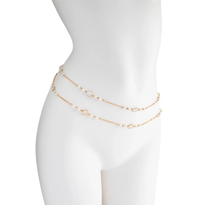 Detail of double-layer gold chain body jewelry with white pearls and clear crystals