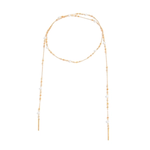 Detail of vintage long necklace with white pearls, orange beads and gold bar pendants