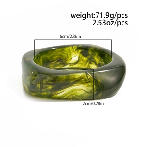 Detailed view of emerald green marble resin bangle with 6cm inner diameter and 2cm width