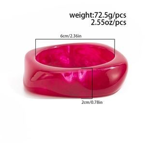 Detail showing red acrylic bangle dimensions of 6cm inner diameter and 72.5g weight