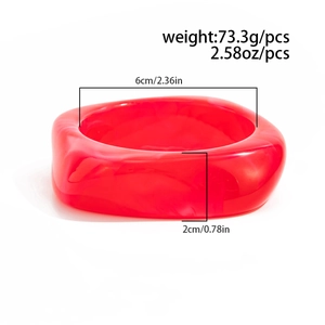 Detail showing dimensions of red translucent irregular acrylic bangle with 6cm inner diameter